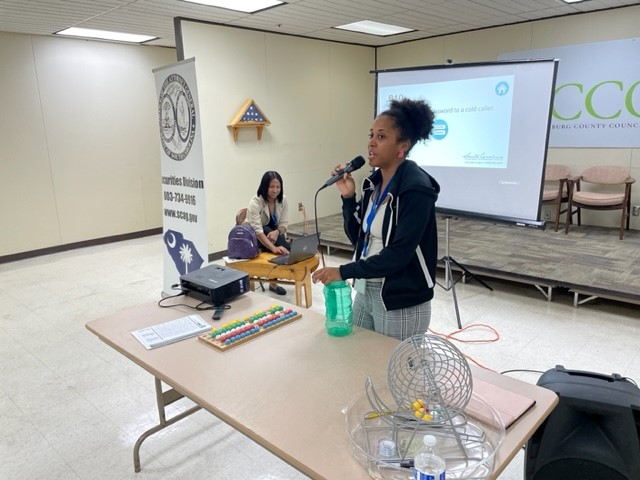 Photo of a member of the SCDCA staff giving a presentation.
